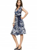 girl in short dress looking side opposite